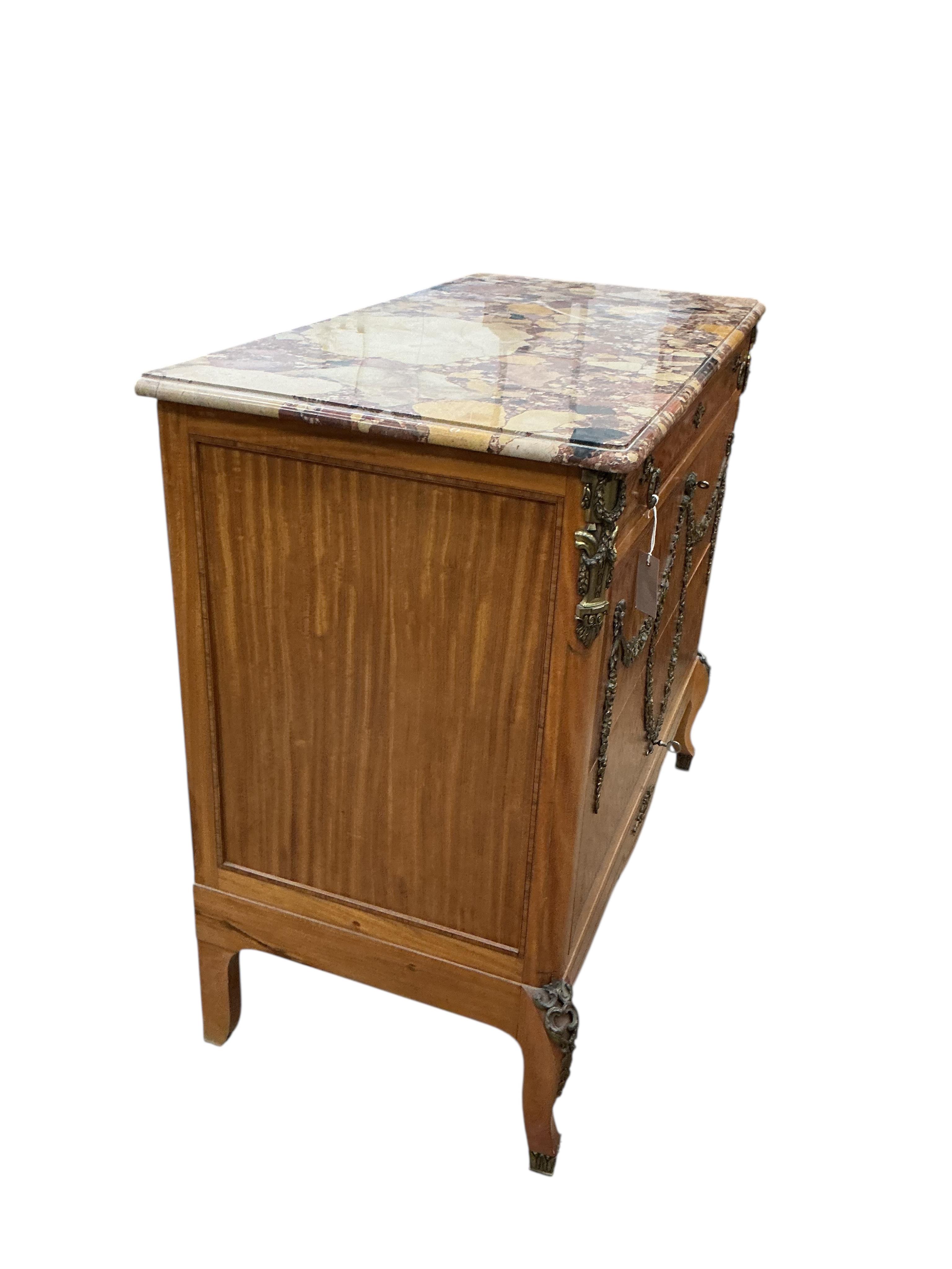 An early 20th century French transition style gilt metal mounted parquetry inlaid marble topped chest, fitted slide, width 99cm, depth 50cm, height 91cm